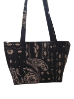 Upgrade your daily carry with our African Print Zip-Top Tote. Perfectly balancing functional design with high-impact aesthetics, this bag takes you from morning meetings to weekend brunch without missing a beat. Product Features: Secure Closure: Durable top zipper to keep your essentials safe. Spacious Design: Roomy interior for your laptop, makeup bag, and daily essentials. Sturdy Straps: Reinforced shoulder straps for comfortable all-day wear. Premium Fabric: 100% authentic African Wax Print (Ankara) with a structured lining.