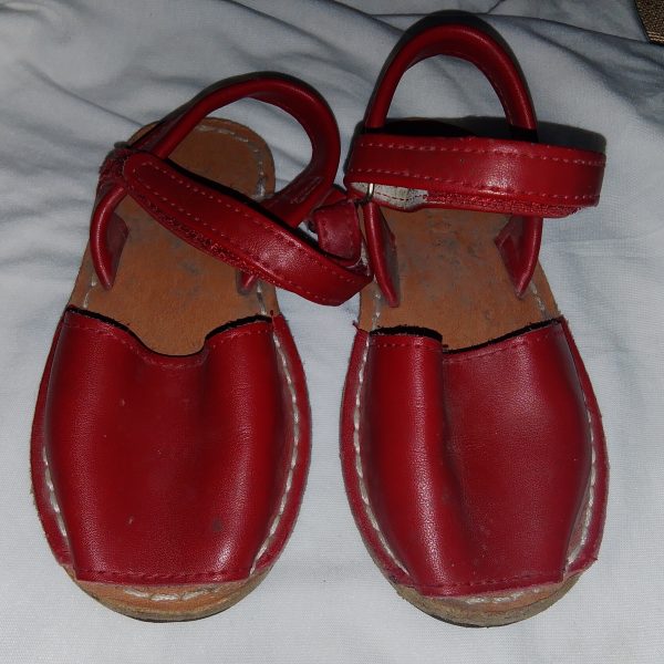 Specifications Brand: Rhoda Handmades. Material: High-quality leather upper and inner lining. Color: Classic White. Closure Type: Adjustable ankle strap with hook-and-loop fastening. Origin: Expertly handmade with attention to detail.