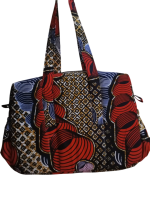 Upgrade your daily carry with our African Print Zip-Top Tote. Perfectly balancing functional design with high-impact aesthetics, this bag takes you from morning meetings to weekend brunch without missing a beat. Product Features: Secure Closure: Durable top zipper to keep your essentials safe. Spacious Design: Roomy interior for your laptop, makeup bag, and daily essentials. Sturdy Straps: Reinforced shoulder straps for comfortable all-day wear. Premium Fabric: 100% authentic African Wax Print (Ankara) with a structured lining.