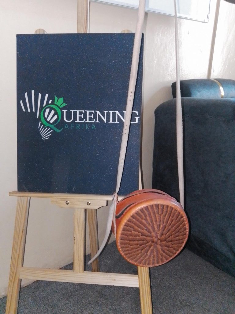 Specifications Material: Sustainable hand-woven fibers and genuine leather. Colorway: Midnight Black with a Royal Violet horizontal accent. Handle Style: Double shoulder straps for comfortable, all-day carry. Origin: Inspired by and crafted through traditional African weaving techniques.